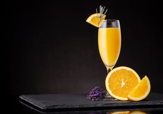 Mimosa cocktail in champagne glass
